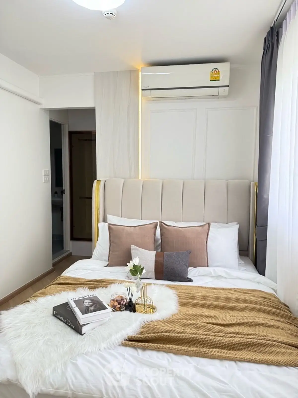 Cozy bedroom with stylish decor and air conditioning