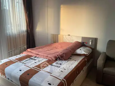 Cozy bedroom with modern decor and natural light