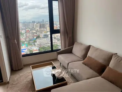 Modern living room with city view, featuring a cozy sofa and elegant decor.