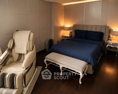 Luxurious bedroom with massage chair and elegant decor