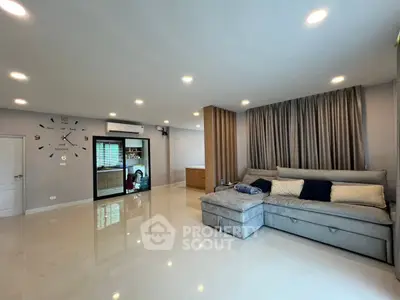 Spacious modern living room with elegant decor and ample natural light