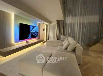 Luxurious modern living room with ambient lighting and plush seating