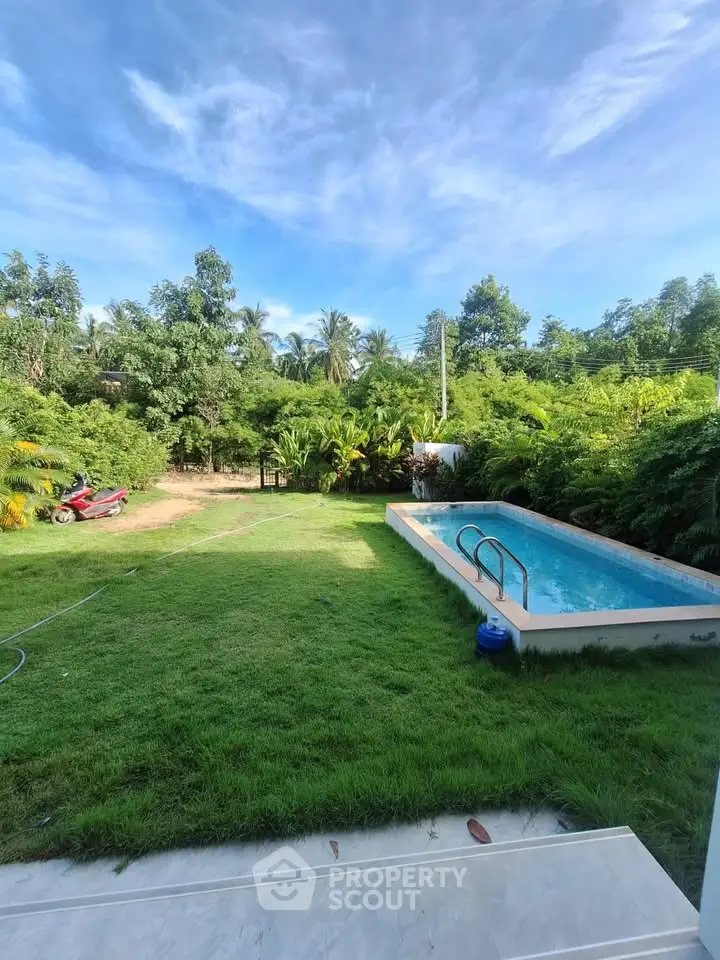 Stunning backyard with lush greenery and a private pool, perfect for relaxation and outdoor enjoyment.