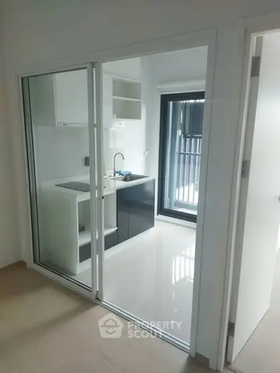 Modern kitchen with sleek design and sliding glass doors