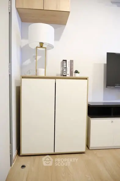 Modern living room corner with stylish cabinet and decor