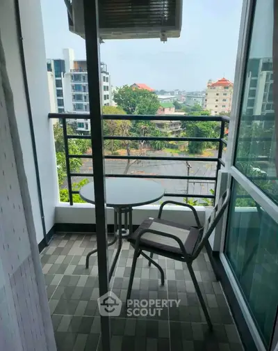 Charming balcony with city view, perfect for relaxation and enjoying the outdoors.