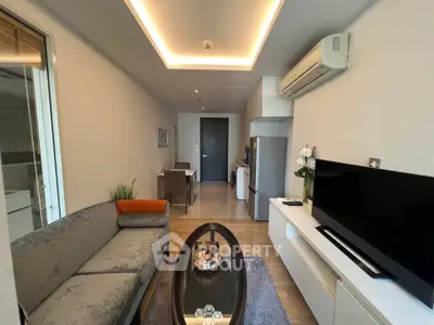 Modern living room with sleek furniture and stylish decor in a contemporary apartment.