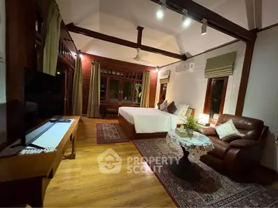 Luxurious bedroom with elegant decor and cozy seating area, perfect for relaxation and comfort.