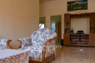 Spacious living room with elegant furniture and entertainment center