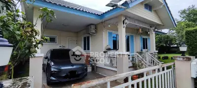 Charming suburban home with lush garden and attached carport, perfect for family living.