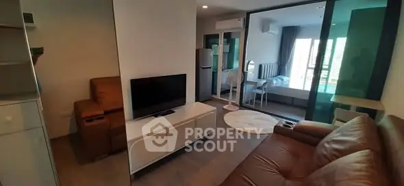 Modern apartment interior with cozy living room and bedroom view