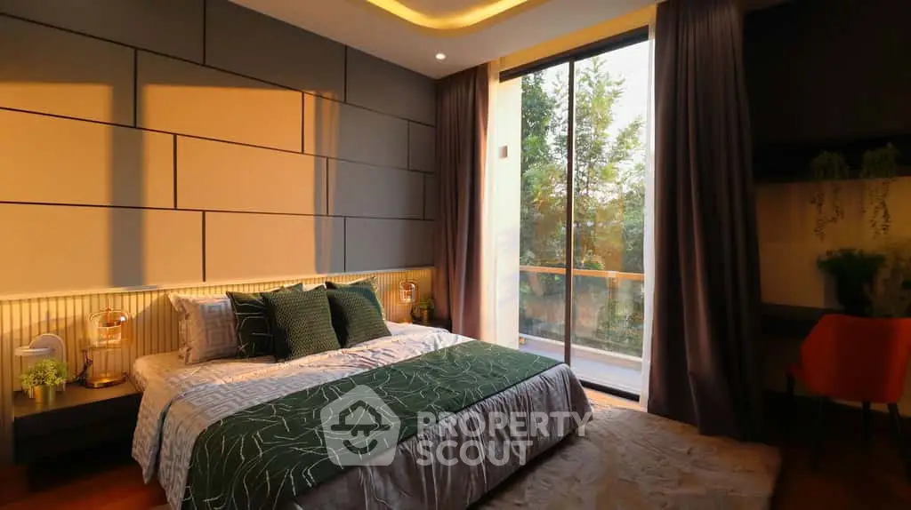 Luxurious bedroom with modern decor and large window overlooking greenery, perfect for relaxation.