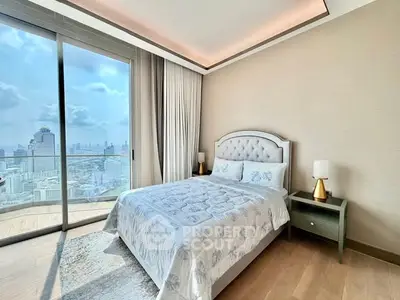 Luxurious bedroom with stunning city view and elegant decor in high-rise apartment.