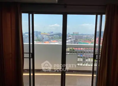 Spacious balcony with stunning city view, perfect for relaxation and enjoying urban skyline.