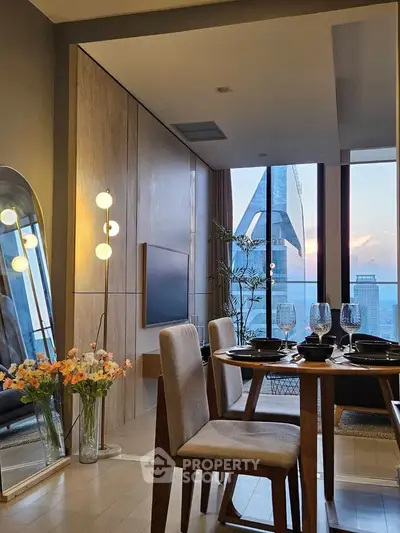 Modern dining area with stunning city view and elegant decor