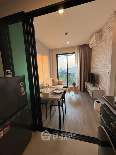 Modern living room with city view, open layout, and stylish decor