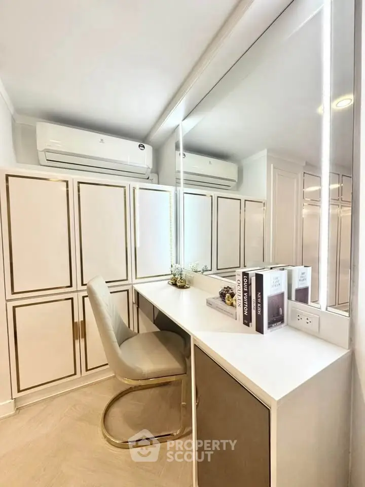 Elegant study area with modern desk, chair, and ample storage cabinets.