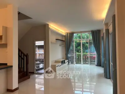 Spacious living room with large windows and modern design
