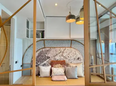 Luxurious modern living room with stylish decor and large windows offering stunning views.