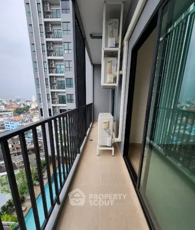 Spacious balcony with city view in modern high-rise apartment