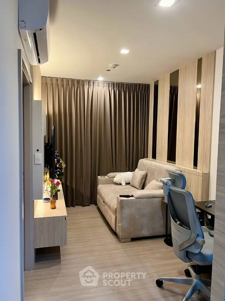 Modern living room with cozy sofa and stylish decor in a compact space
