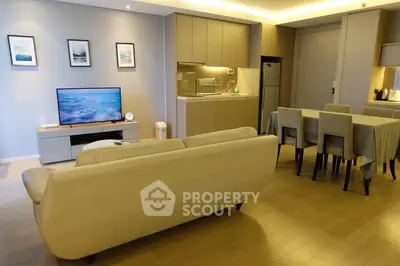 Modern open-plan living room with stylish kitchen and dining area