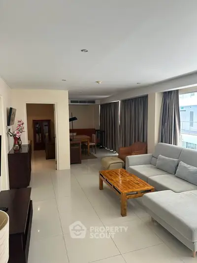 Spacious modern living room with elegant furniture and natural light