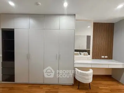 Modern bedroom with sleek built-in wardrobe and stylish vanity desk