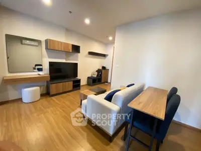 Modern living room with sleek furniture and wooden flooring