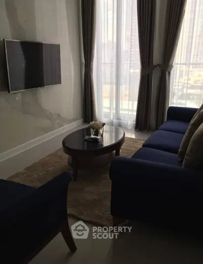 Cozy living room with modern decor and large window view