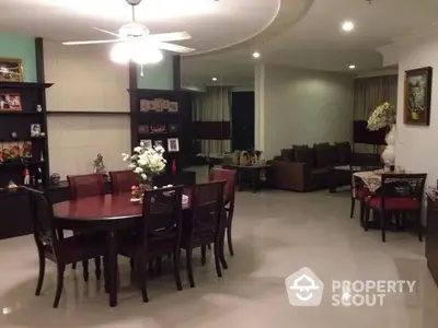 Spacious living and dining area with elegant furniture and ambient lighting