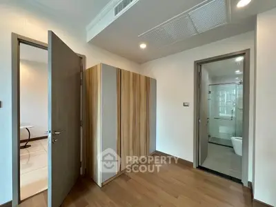 Modern apartment interior with wooden flooring and sleek bathroom design