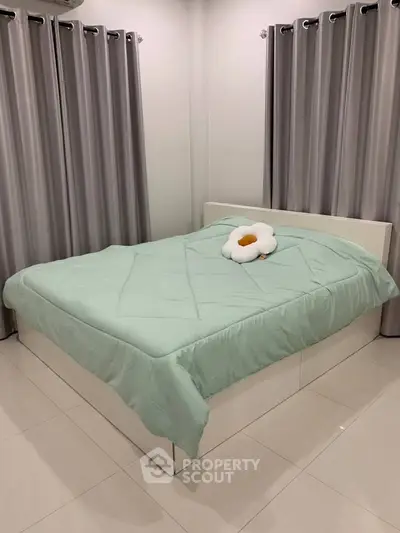 Modern bedroom with stylish curtains and cozy bedding