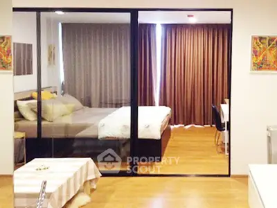 Modern bedroom with sliding glass doors and cozy decor