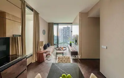 Modern living room with city view, elegant decor, and natural light