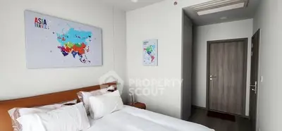 Modern bedroom with stylish decor and world map art on the wall.