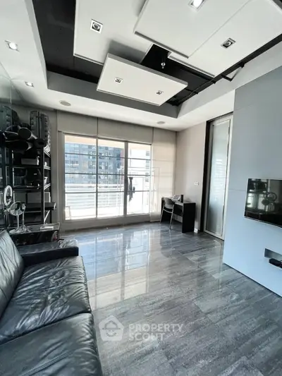 Modern living room with sleek design and large windows in urban apartment