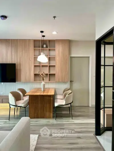 Modern living room with stylish dining area and wooden accents, perfect for contemporary urban living.