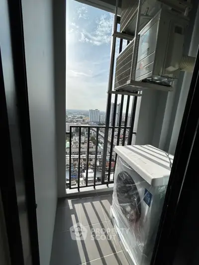 High-rise balcony with city view and washing machine setup.