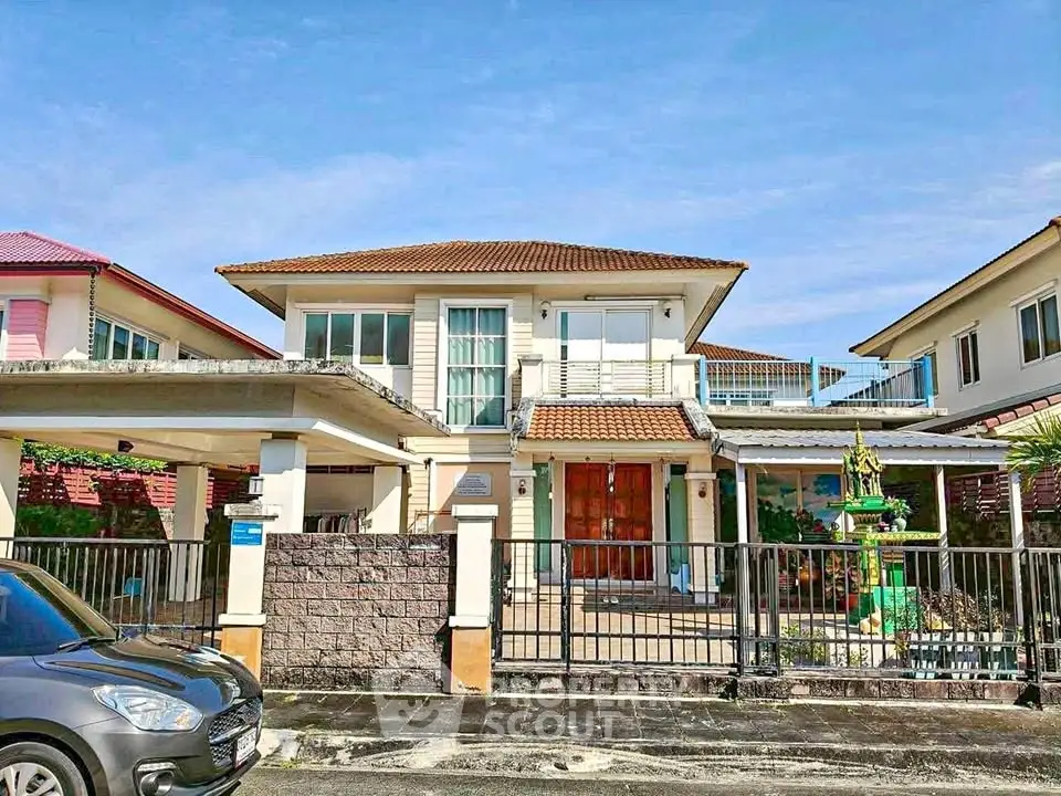 Charming two-story house with spacious driveway and modern exterior design in a suburban neighborhood.