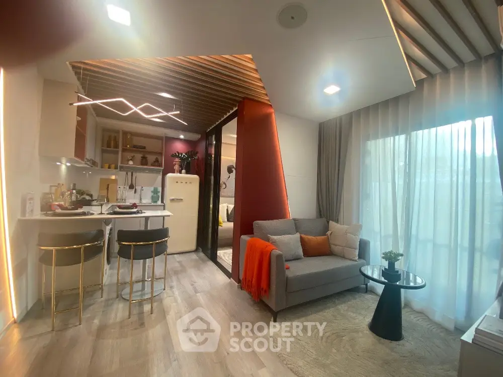 Modern open-plan living room with stylish kitchen and cozy decor