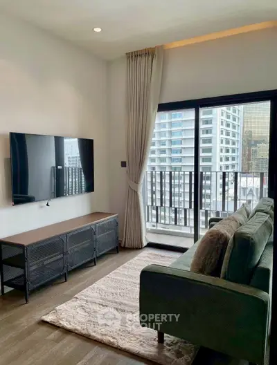 Modern living room with balcony view in high-rise apartment