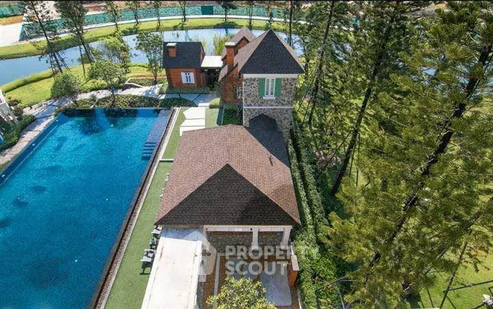 Luxurious estate with pool and lush greenery, perfect for serene living.