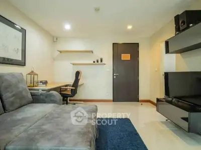 Modern living room with stylish furniture and sleek decor in a contemporary apartment.