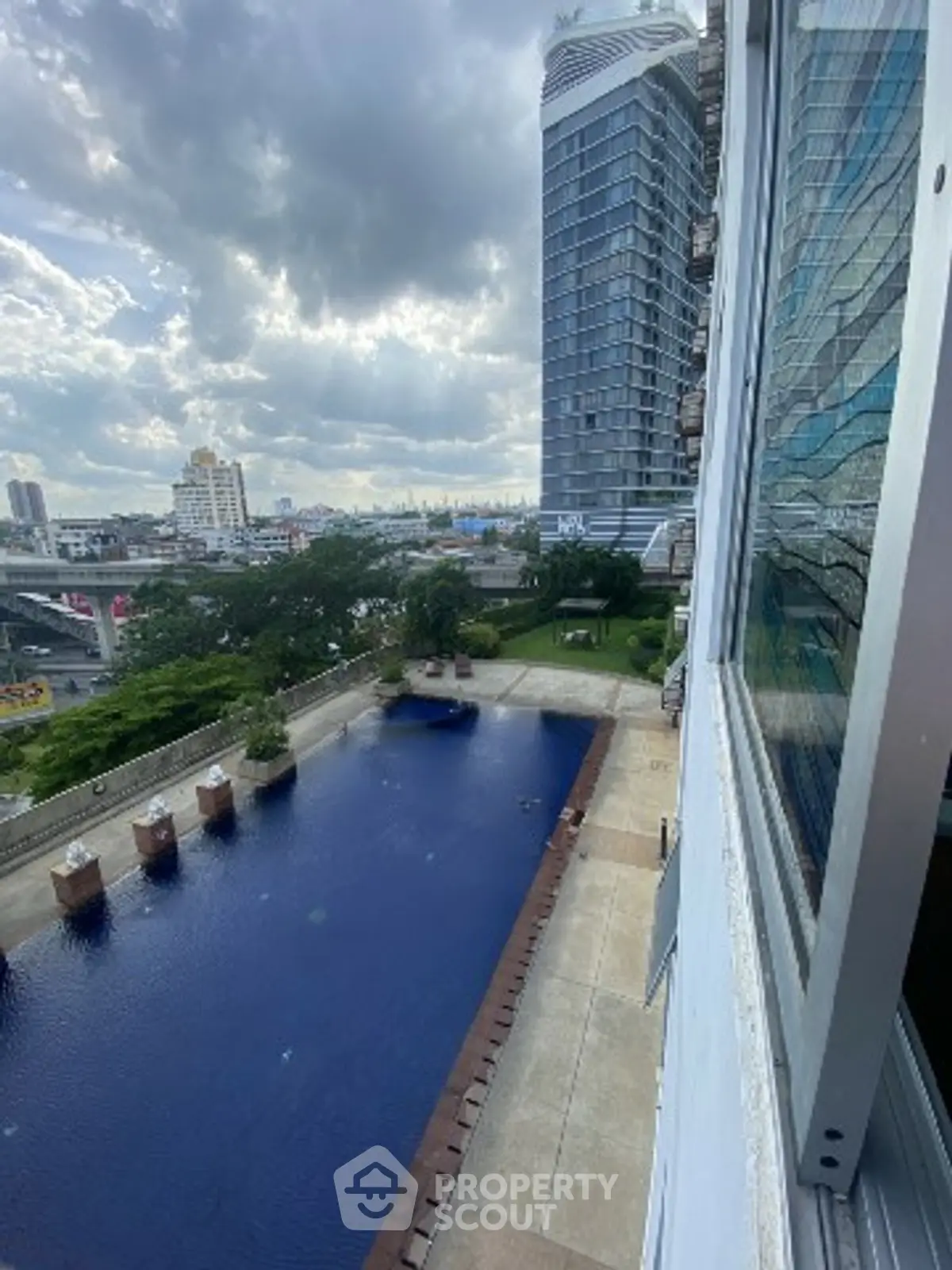 Stunning high-rise view with pool and modern architecture