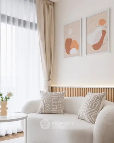 Elegant living room with modern decor and abstract art on the wall.