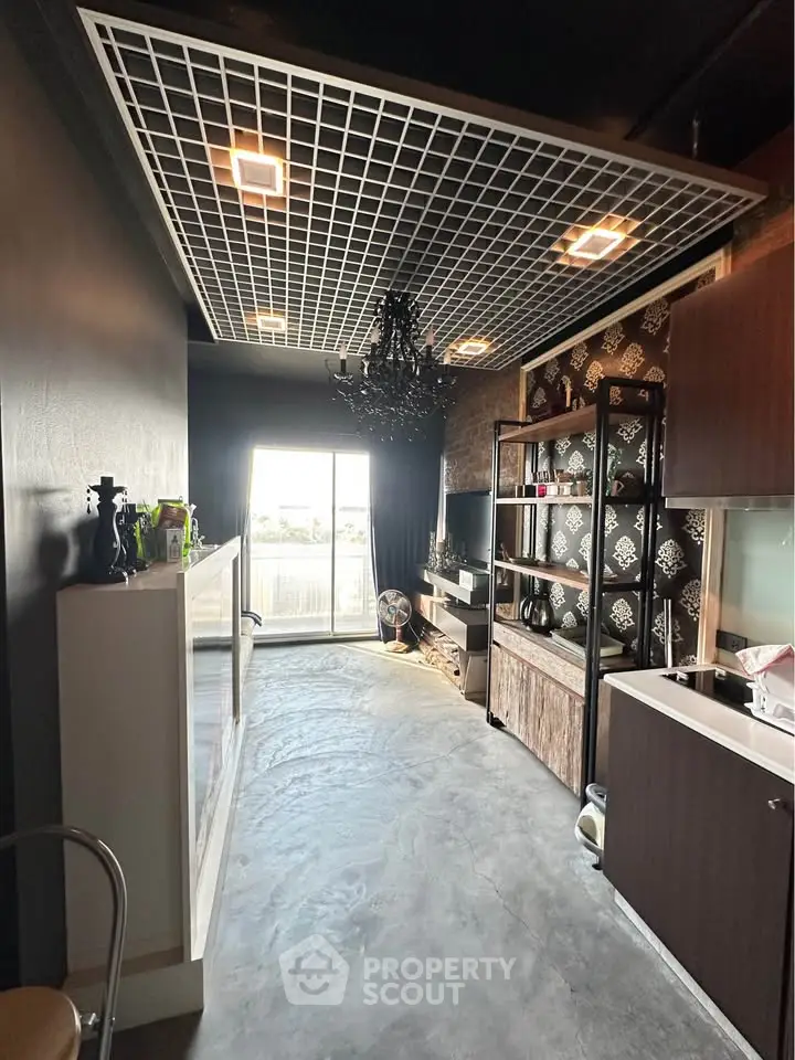 Modern living room with unique ceiling design and open layout, featuring stylish decor and natural light.