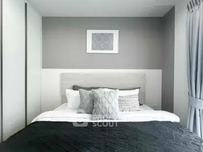 Modern bedroom with stylish decor and cozy bedding