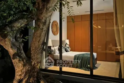 Luxurious bedroom with large window view and elegant wooden decor