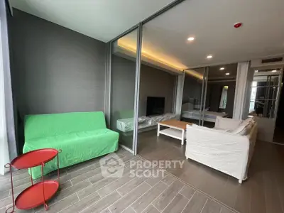 Modern living room with glass partitions and stylish furniture